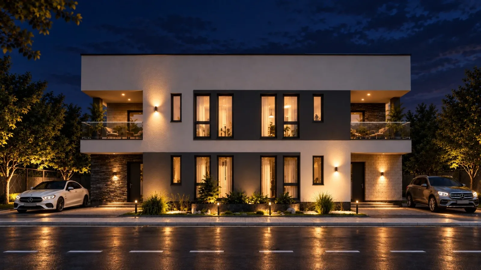 Casă modernă cu două niveluri, fotografiată seara, cu terase acoperite și parter vitrat luminat